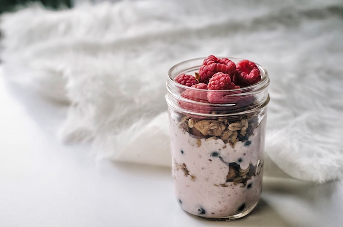healthy breakfast, healthy meal plans, yogurt with oats, raspberries and blackberries, inside a glass cup