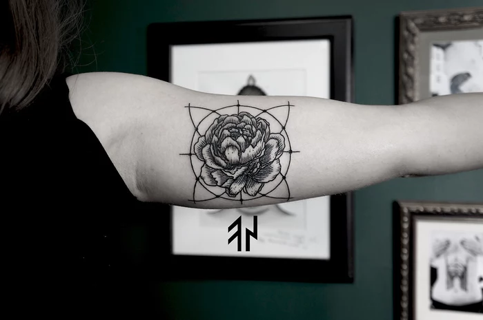 framed paintings on the wall, sacred geometry tattoo, rose flower in the middle of a circle