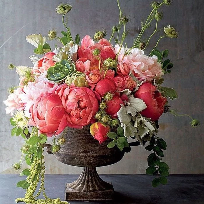 vintage vase, pink and white flowers, large flower bouquet, beautiful flower arrangements, in front of a grey background