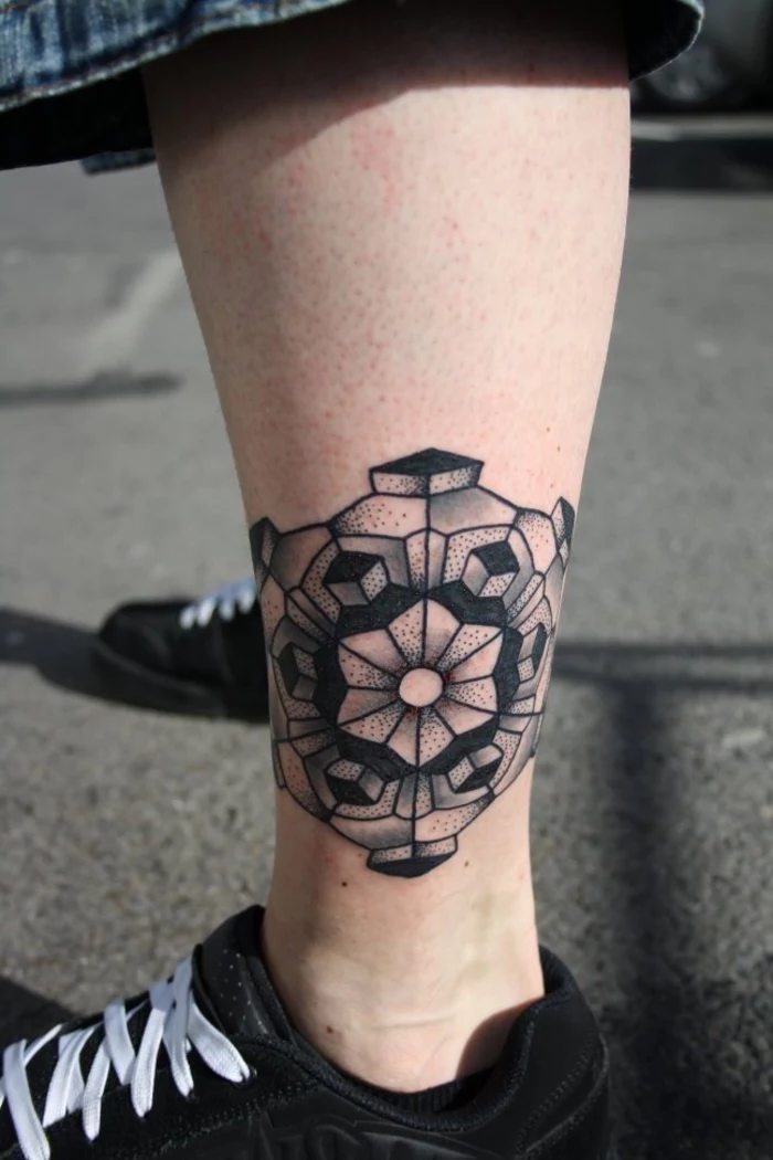 ankle tattoo, geometric tattoo meaning, black sneakers, geometrical shapes, white laces