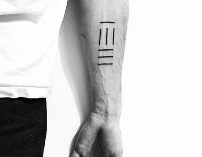 seven black lines, forearm tattoo, man wearing white shirt, black trousers, inner arm tattoos