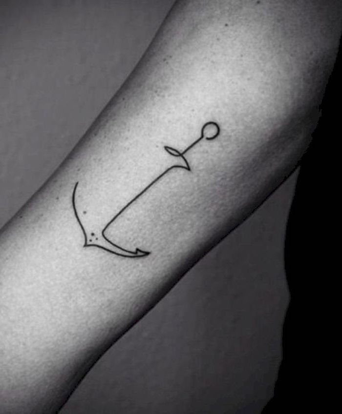 small black line anchor, forearm tattoo, tribal tattoos for men, grey background, black shirt