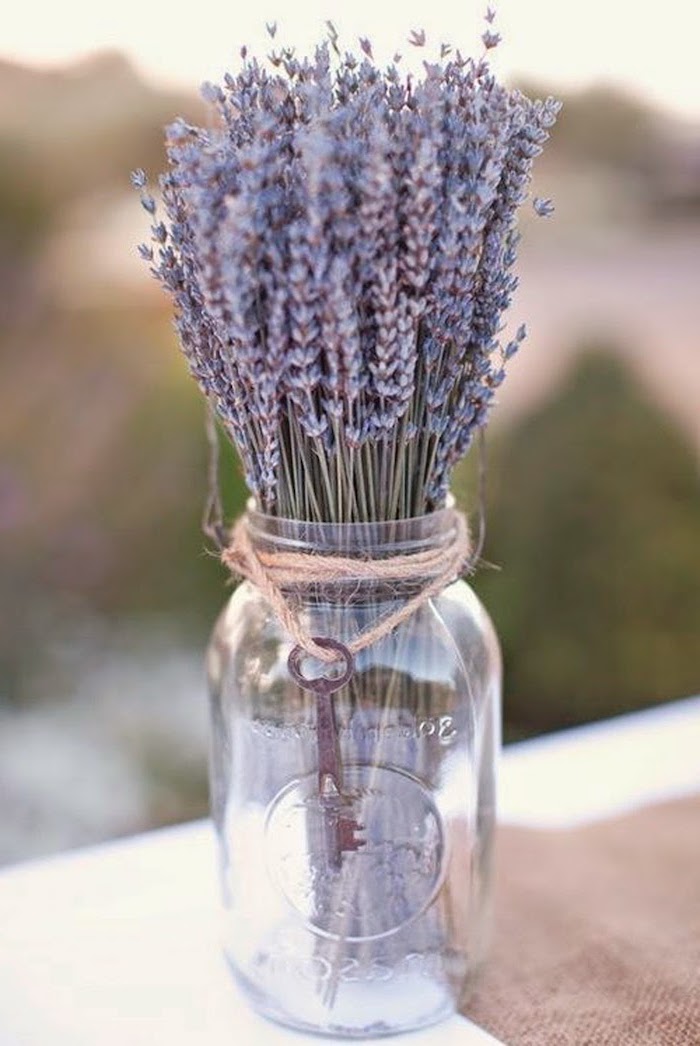 blurred background, diy flower arrangements, lavender bouquet, in a mason jar, with a vintage key