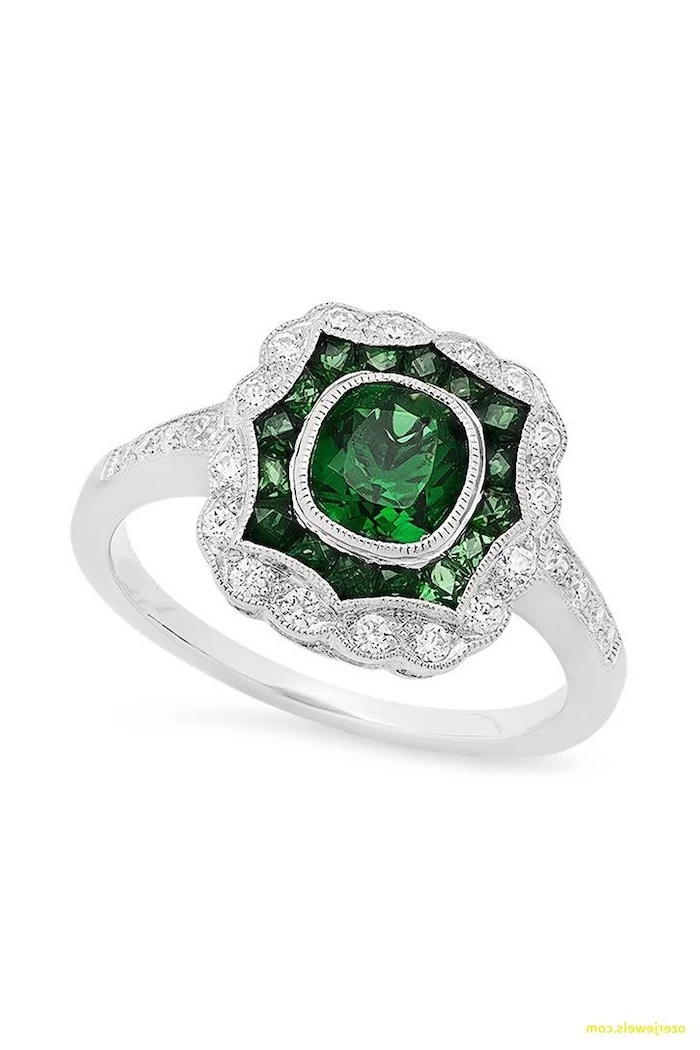 square cut emerald stone in the middle, diamond studded band, diamond band engagement rings