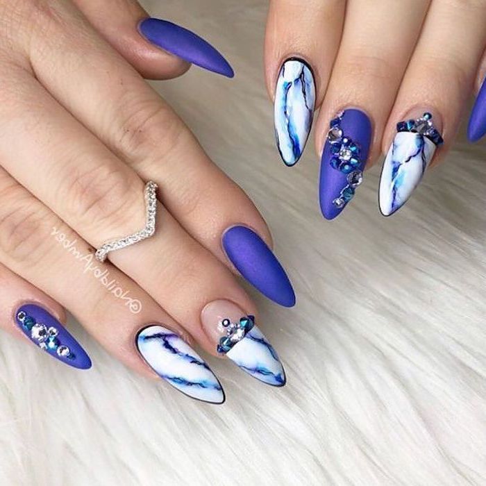 long stiletto nails, trending nail colors, blue matte nail polish, blue and white marble nails
