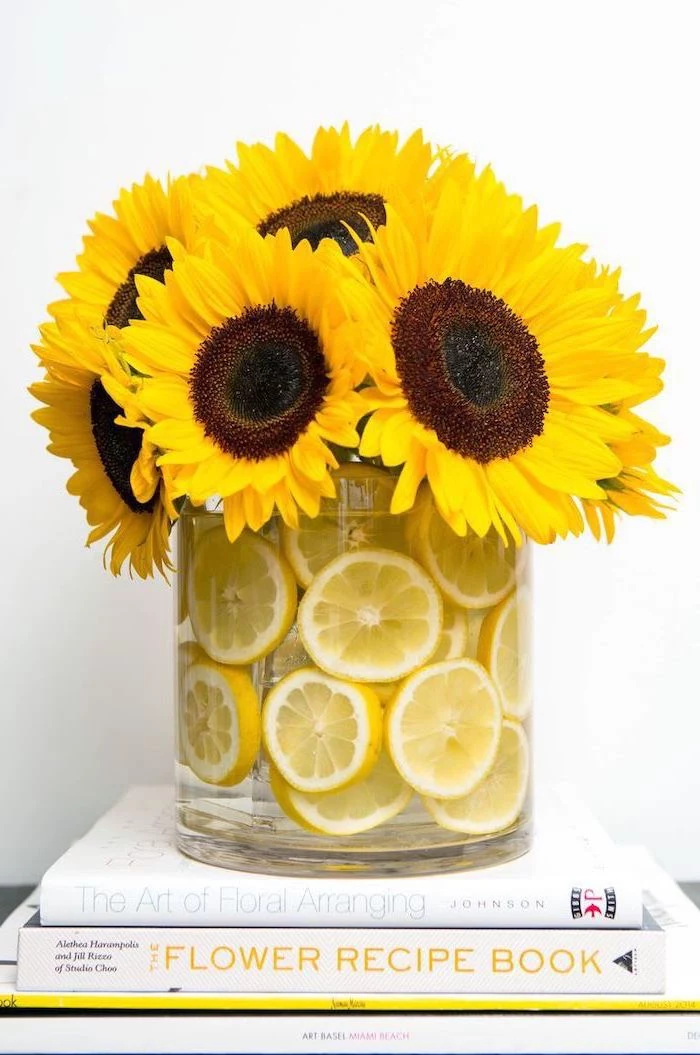 large sunflower bouquet, floral arrangements, large round glass vase, filled with lemon slices