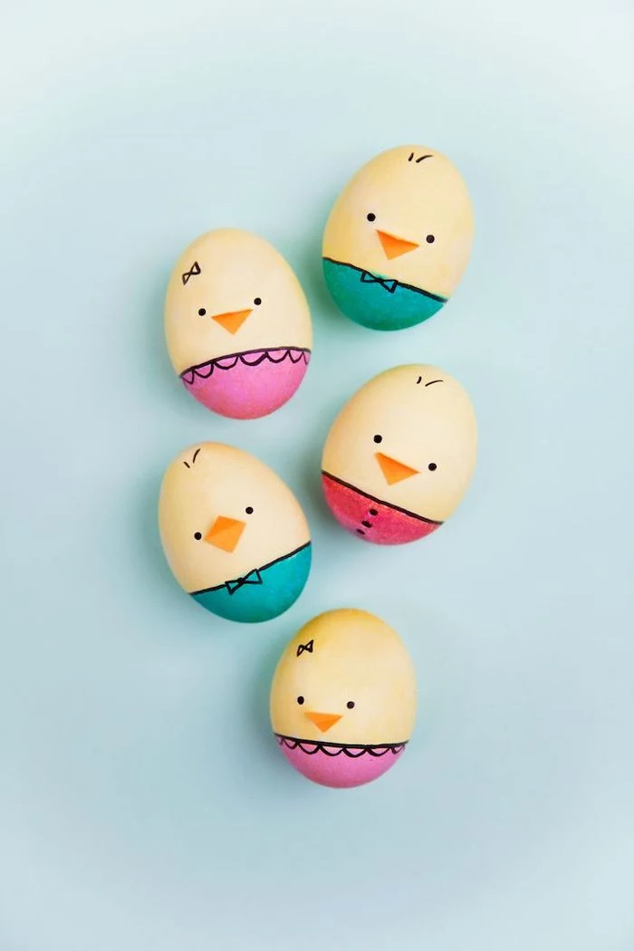 chicken shaped eggs, with orange beaks, yellow and red, pink and turquoise, how to dye easter eggs