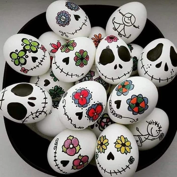 how to decorate easter eggs, tim burton inspired, white eggs, with drawings on them, in a black bowl