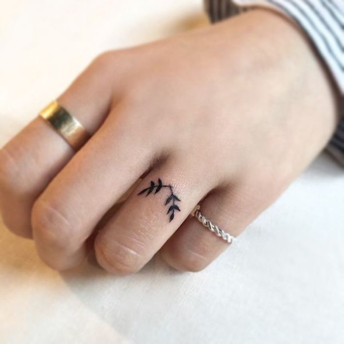 two tree branches, ring finger tattoo, golden and silver rings, finger tattoos for girls