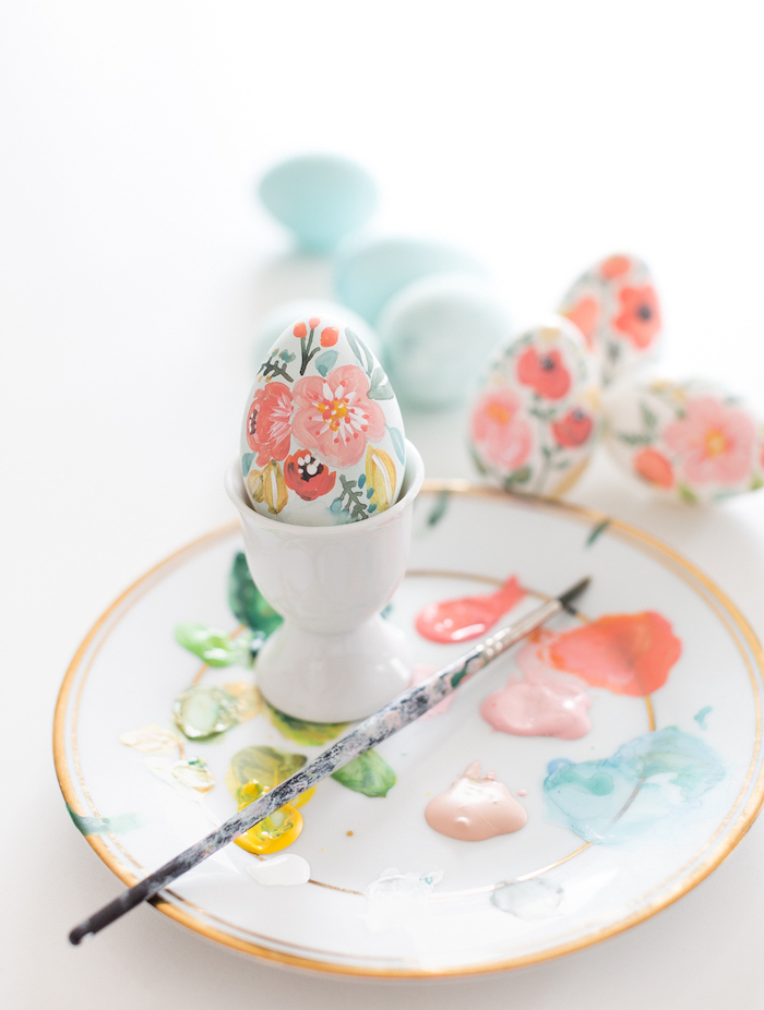 hand painted eggs, how to decorate easter eggs, floral eggs, different coloured paint, on a white plate