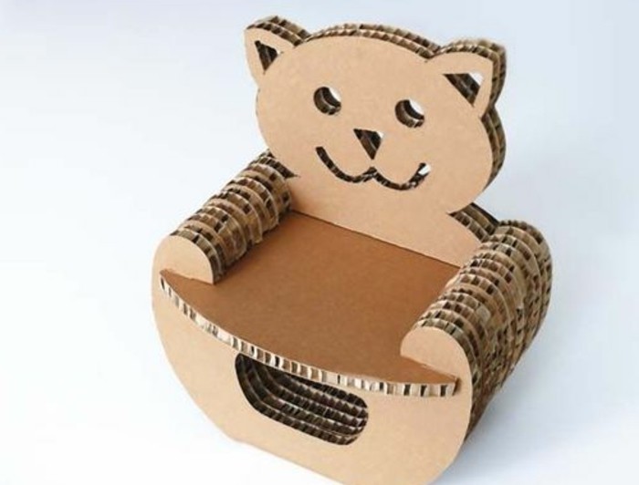 cardboard chair, in a teddy bear shape, in front of a white background