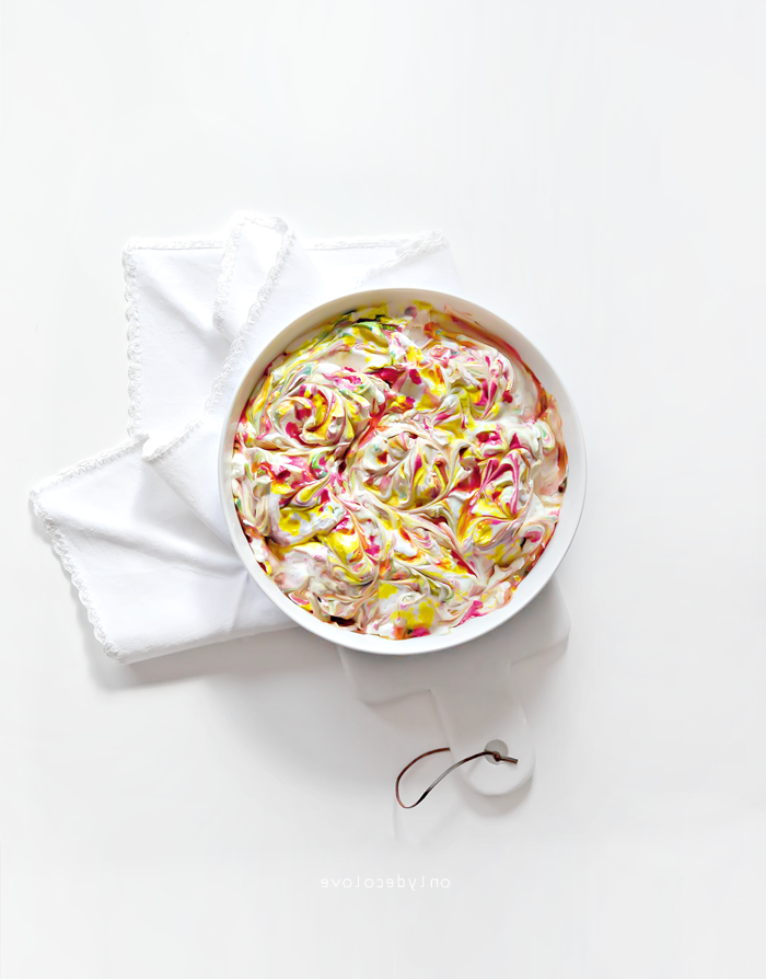 white bowl, full of whipped cream, colourful dye, waster egg decorating, diy tutorial