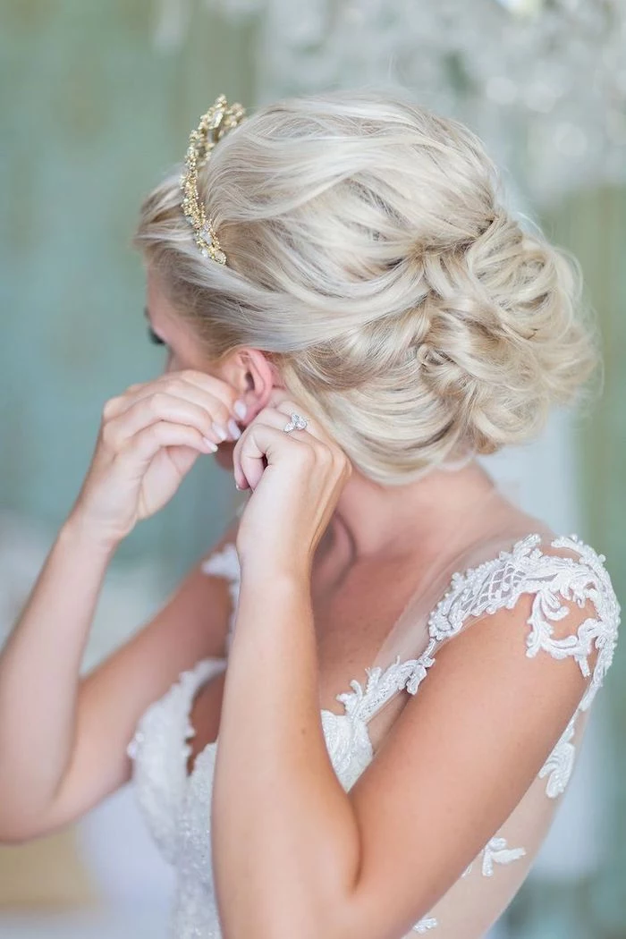 white lace dress, platinum blonde hair in a low updo, golden tiara, bridesmaid hairstyles