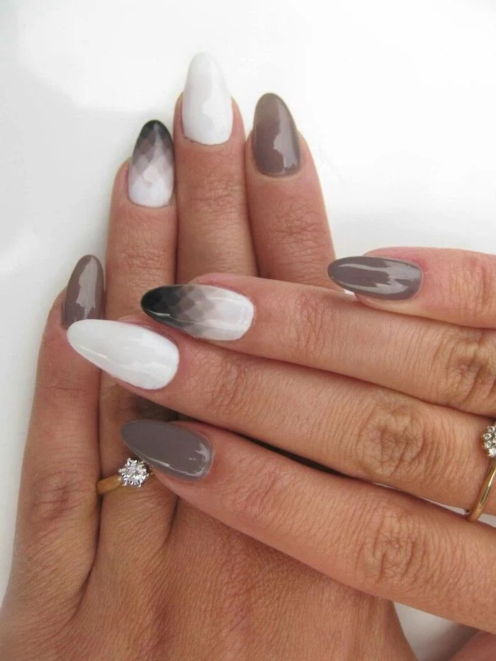 grey black and white nail polish, cute easy nail designs, geometric shapes drawn on two nails
