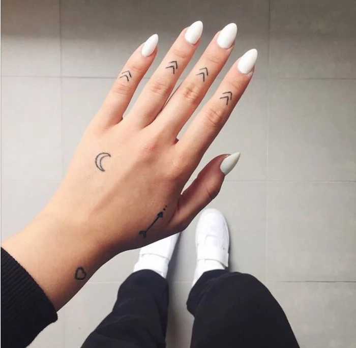 arrows tattoos, on each finger, white nail polish, finger tattoos for girls, white sneakers