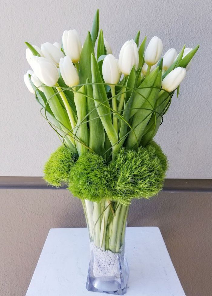 white tulips, large flower bouquet, mason jar flower arrangements, tall glass vase, filled with small decorative stones