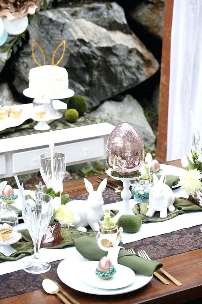easter table decorations centerpieces, white plates, green napkins, ceramic bunny figurines