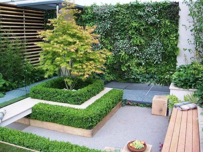 wooden bench with a blanket, short hedges around a tree, small patio ideas, planted trees and bushes