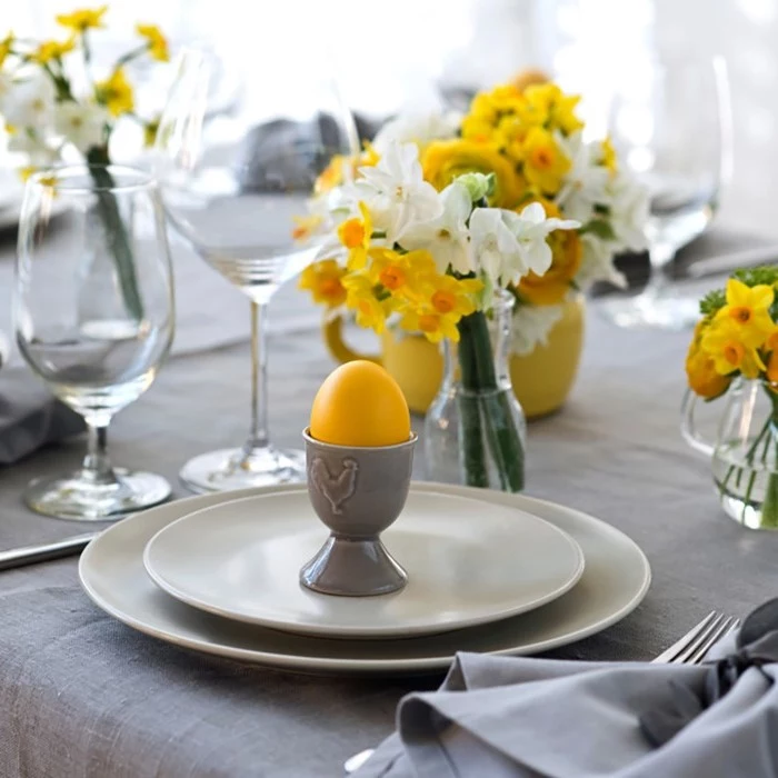 dyed yellow egg, small white and yellow flower bouquets, homemade easter decorations