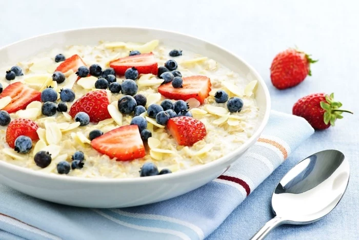 yogurt with oats, with blackberries and strawberries, in a white plate, what is a balanced diet