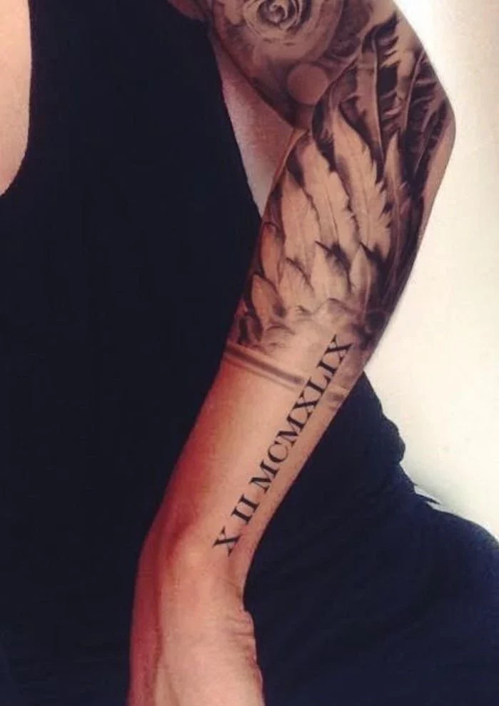 black top, white background, roman numeral photos, angel wing elbow tattoo