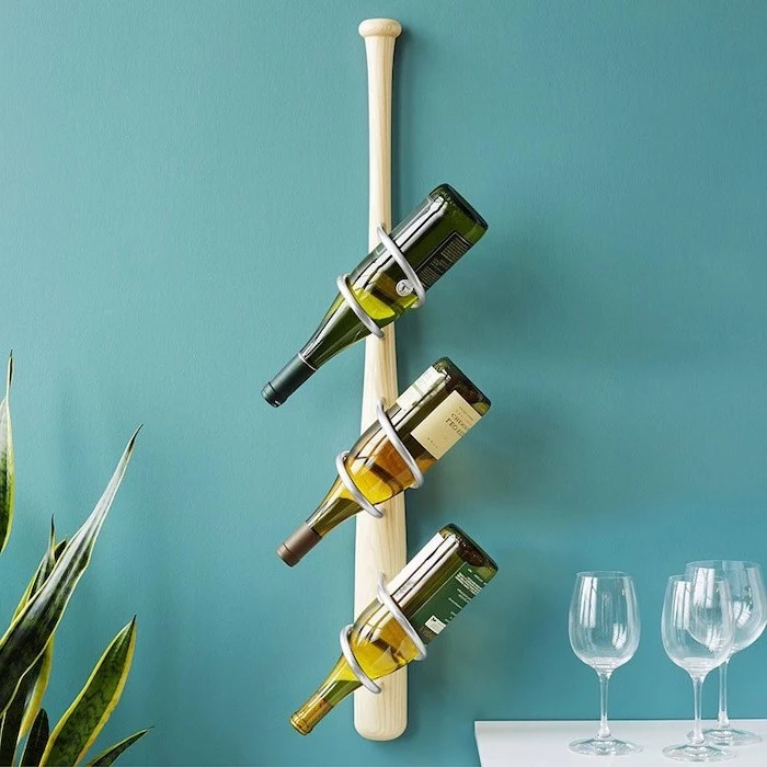 blue wall, baseball bat, wine rack, wine glasses, traditional housewarming gifts