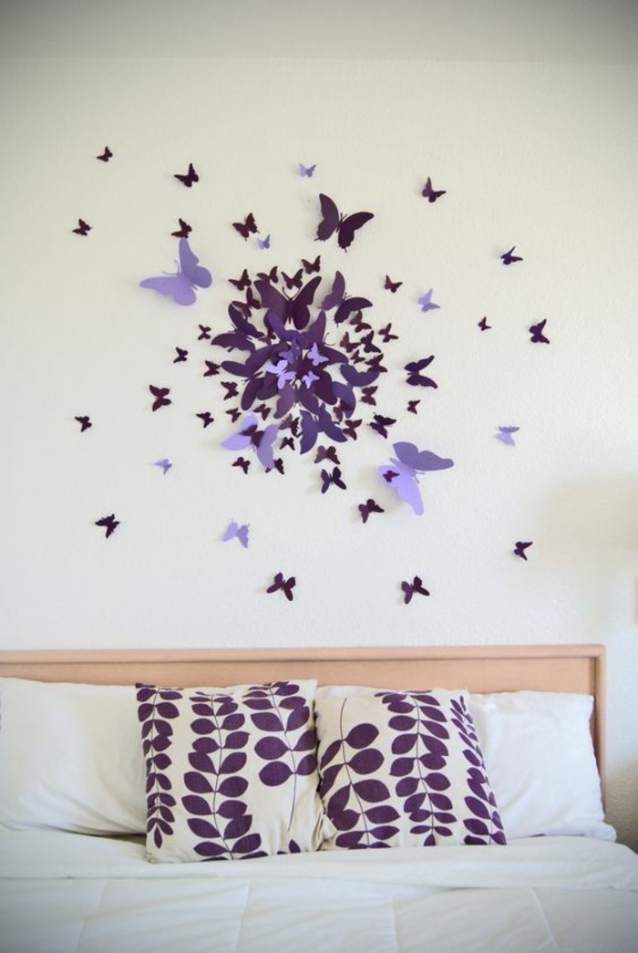 unique wall decor, shades of purple, paper butterflies, hanging over a bed, purple throw pillows