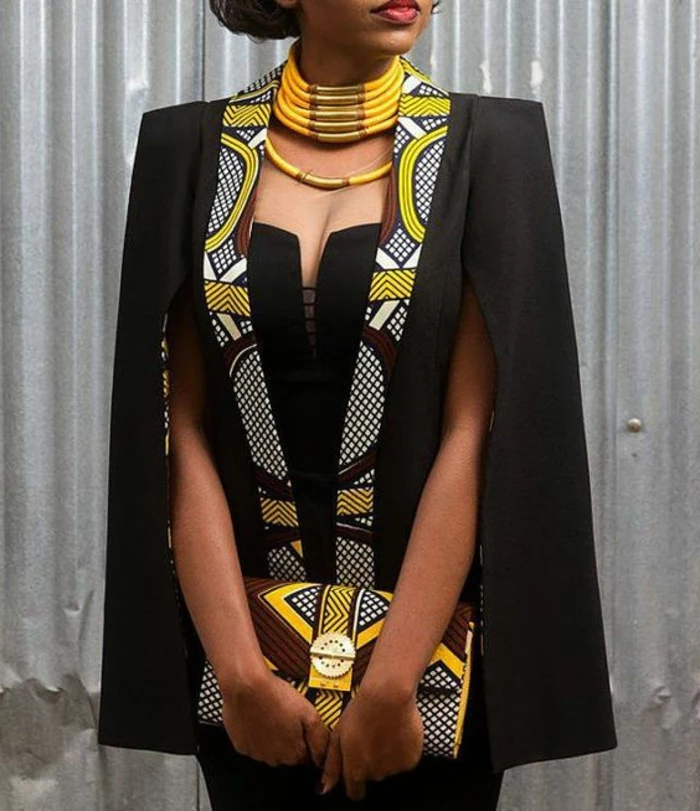 black dress and blazer, large yellow necklace, african attire, patterned clutch bag
