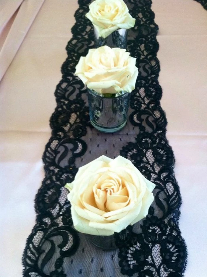 black lace, table runner, table setting images, small glass vases, white rose in each one
