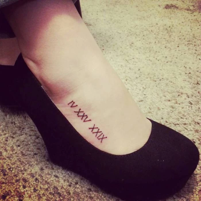 black platform shoes, foot tattoo, birthday in roman numerals