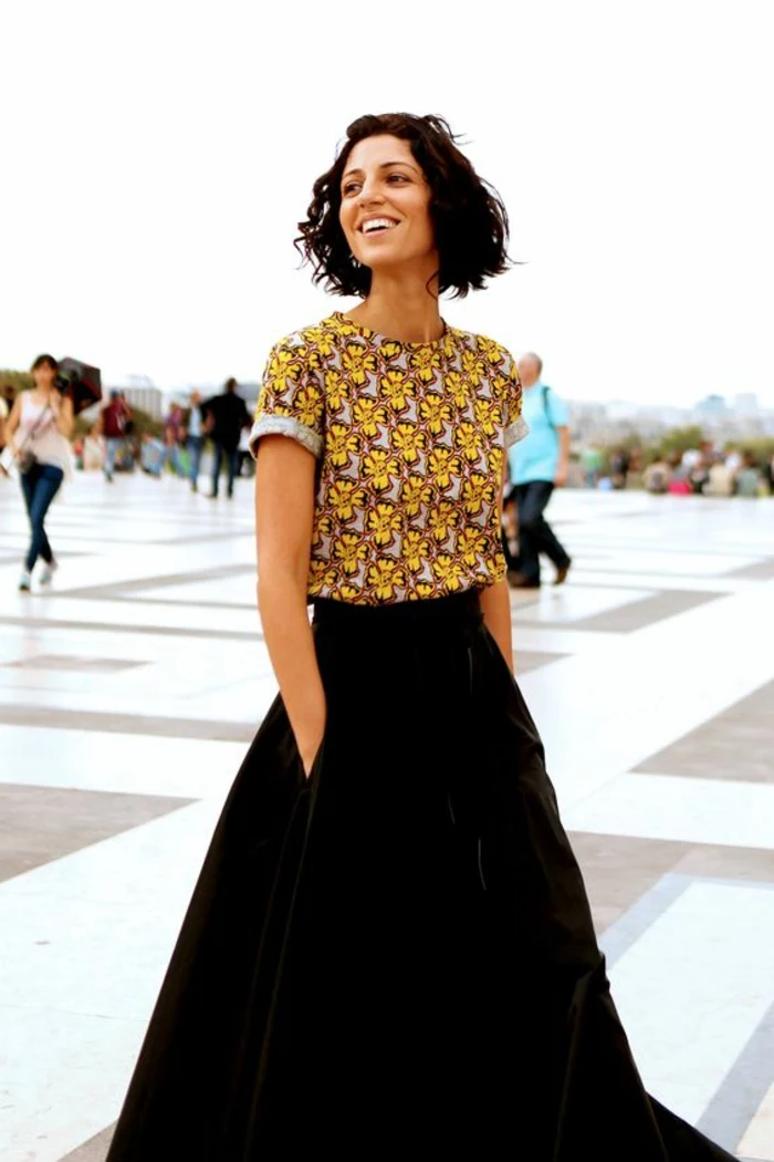 short brown wavy hair, long black velvet skirt, african print fabric, printed crop top