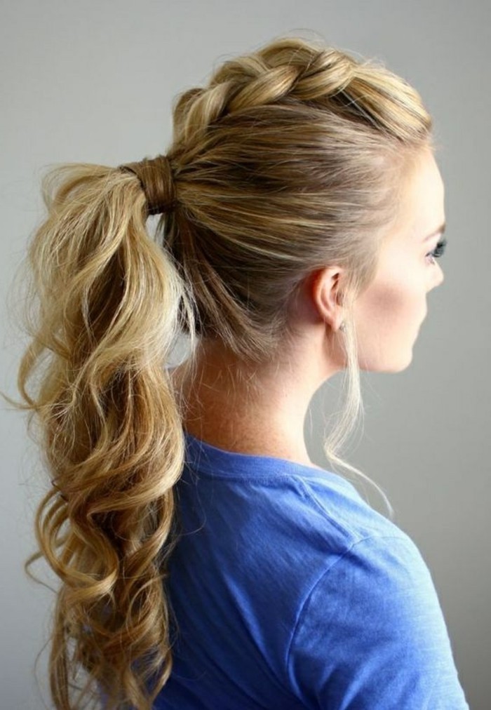 long wavy high ponytail, blonde hair, with highlights, prom hairstyles for short hair, woman wearing a blue shirt