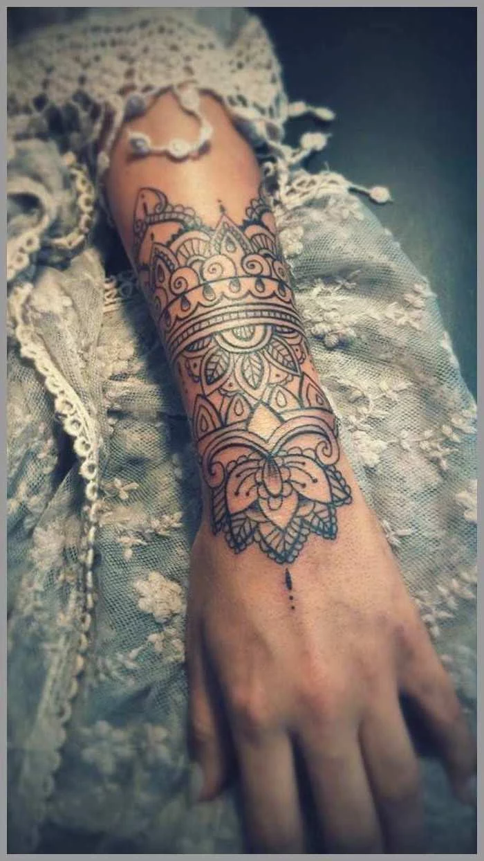 blue and white, lace dress, arm tattoo, mandala tattoo meaning