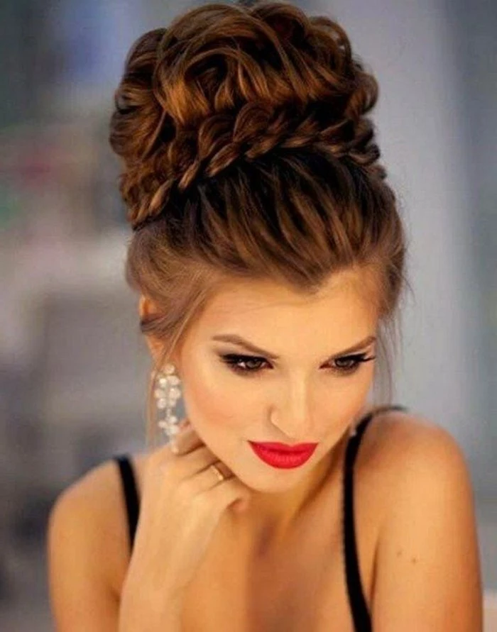 brown hair, in a high messy updo, floral hanging earrings, braid hairstyles for long hair, black straps