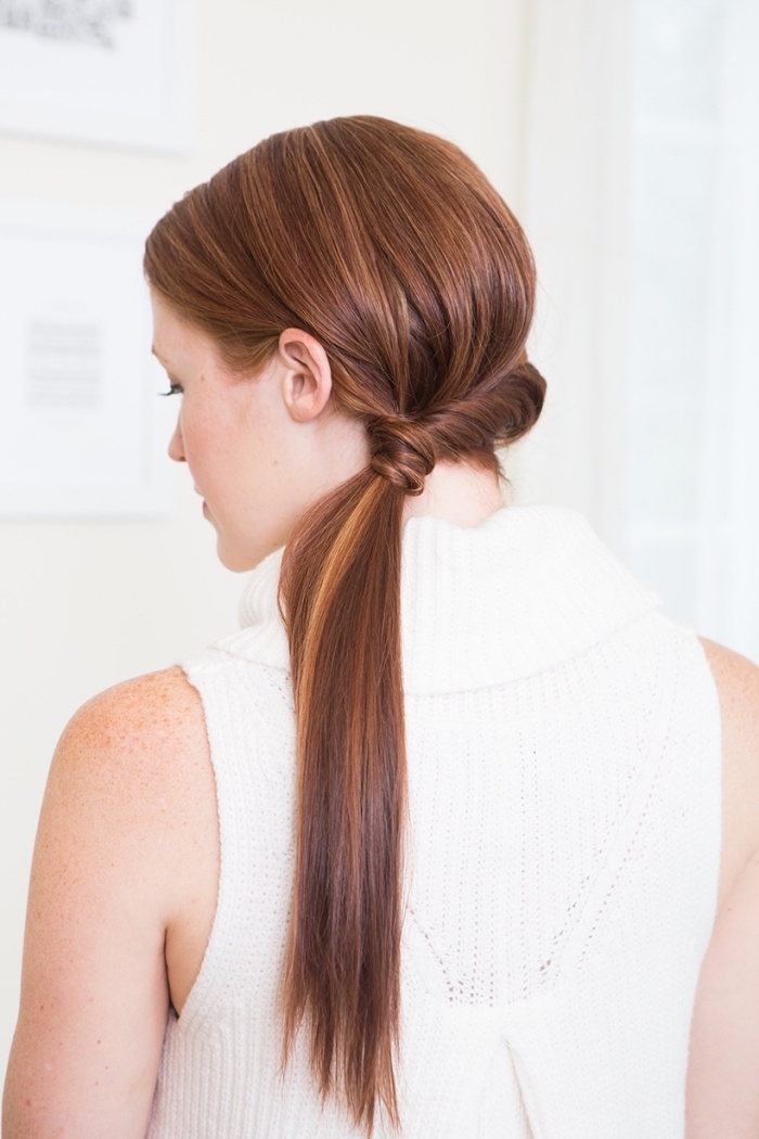 woman wearing a white sweater, long ginger hair, half braid, half ponytail, braid hairstyles, freckles on the shoulder