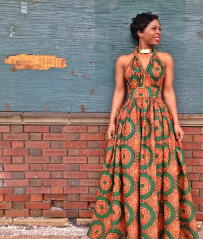 long dress, african print fabric, short curly hair, brick wall, golden necklace