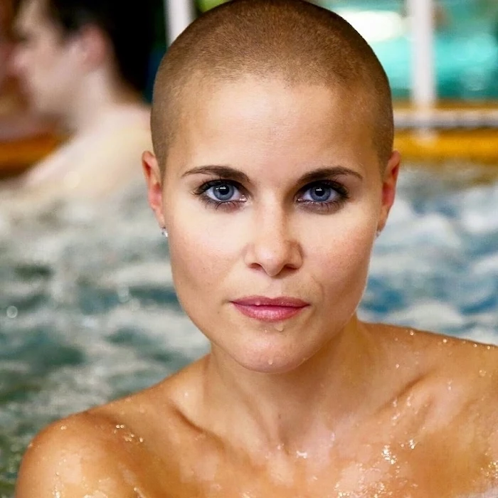 buzz cut, woman in water, with blue eyes, short to medium hairstyles