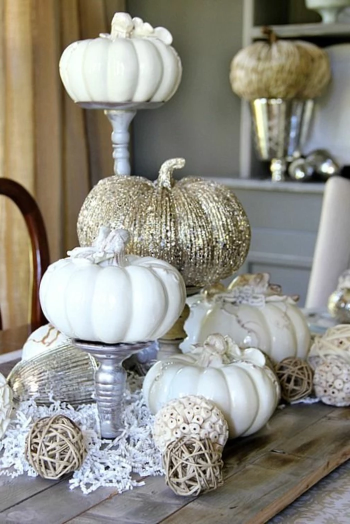 candle holders, white and gold, ceramic pumpkins, table setting images, wooden table, rustic style