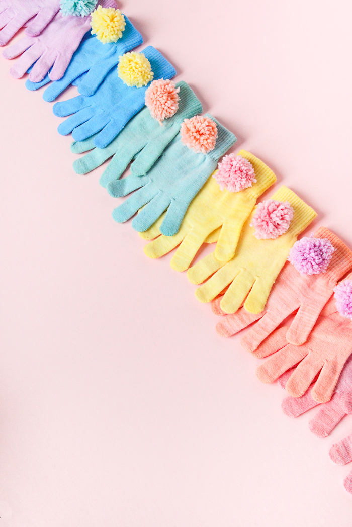 colourful gloves, decorated with colourful pom poms, cute gifts for boyfriend, pink background