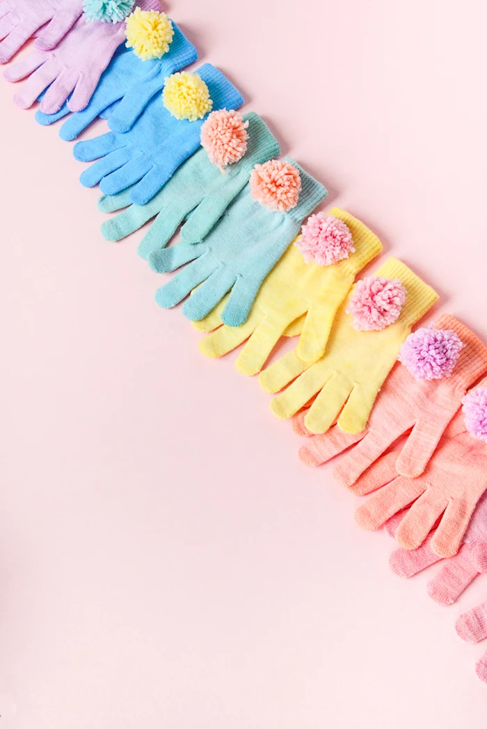 colourful gloves, decorated with colourful pom poms, cute gifts for boyfriend, pink background