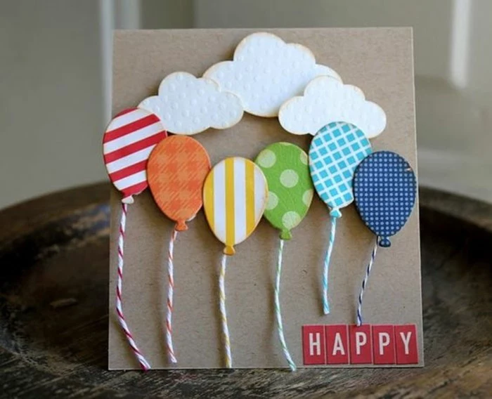 colourful patterned balloons, white clouds, funny things to write in a birthday card, wooden table
