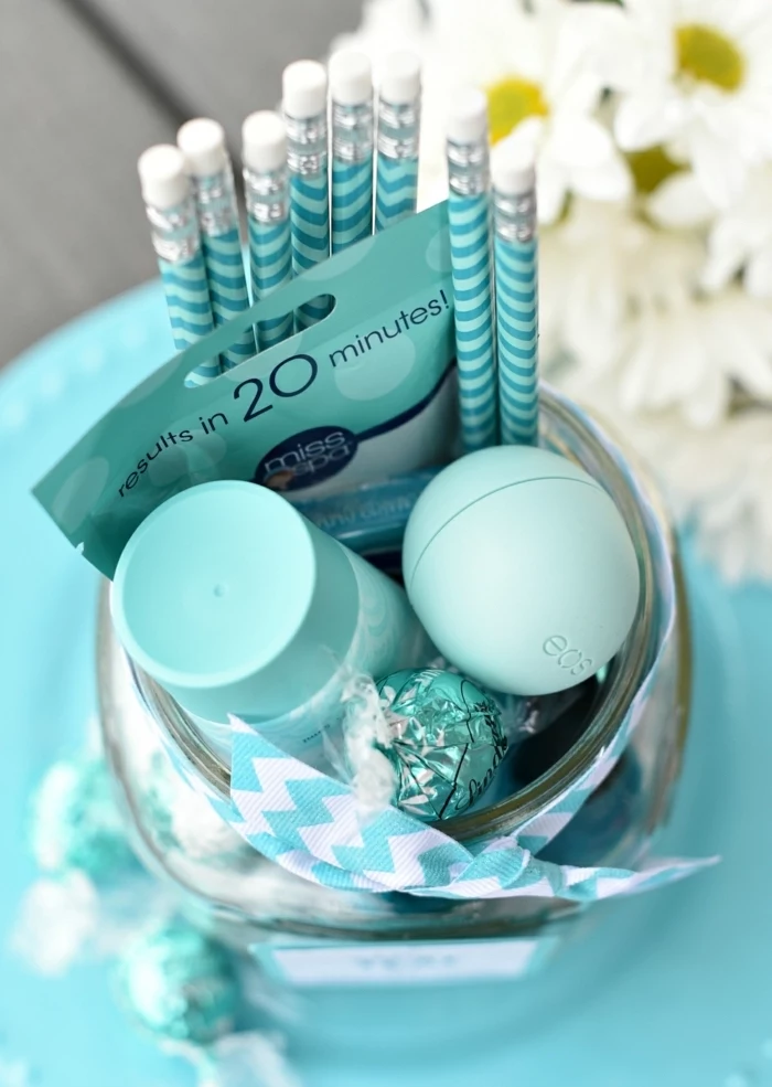 turquoise pencils, eos lip balm, diy gifts for friends, lindt chocolate candies, bouquet of daisies