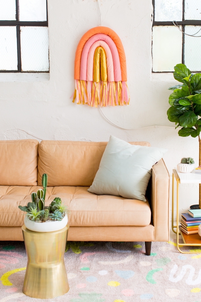 diy rainbow wall art, large wall decor, orange sofa, light blue throw pillow, colourful carpet