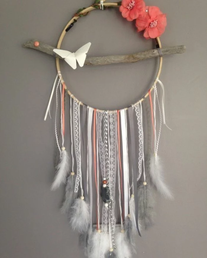 colourful dreamcatcher, hanging on a grey wall, hanging wall decor, grey and white feathers, pink flowers