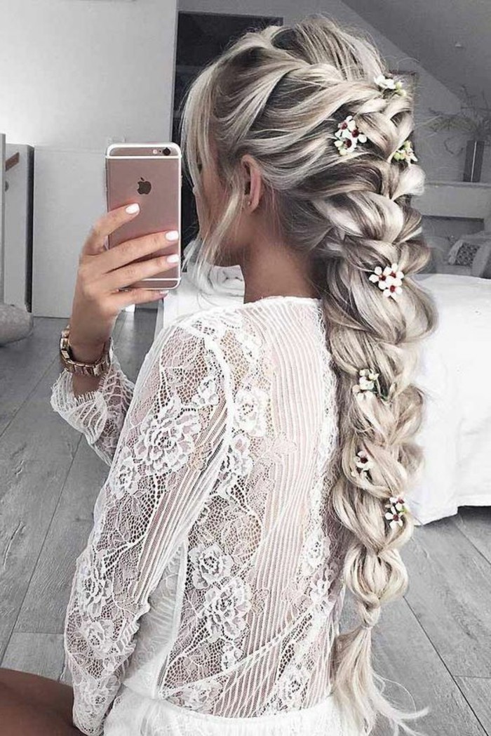 prom hairstyles for long hair, long ash blonde hair, with highlights, in and intricate braid, floral hair accessories