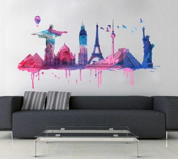 large grey sofa, city landmarks, painted on a white wall, living room wall ideas, glass coffee table