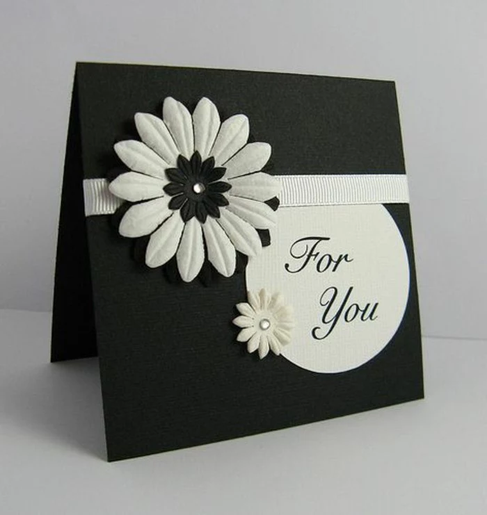 black card stock, white flowers, white ribbon, how to make a birthday card, white background
