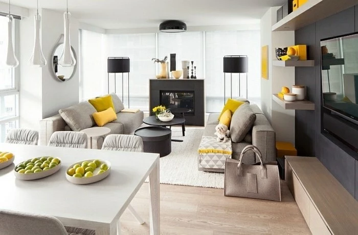 grey sofas, black metal coffee tables, gray and white living room, yellow throw pillows, wooden floor