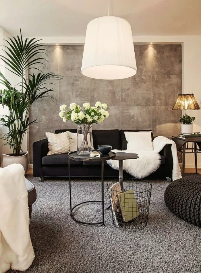 black sofa, white throw pillows, black ottoman, what colors match with grey, potted palm, metal black coffee table