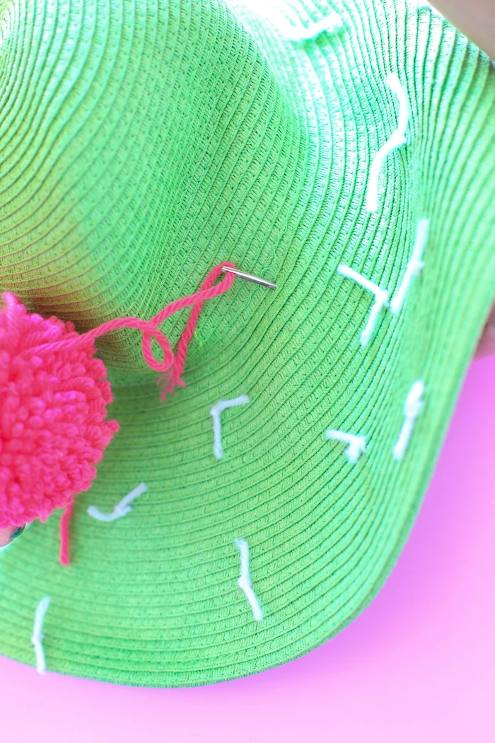 green hat, pink pom pom, pink and white yarn, diy anniversary gifts for him, pink background